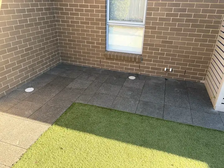 A courtyard cleared of weeds